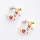 Les Nereides   Gold Tone & White Flower Hoop Earrings